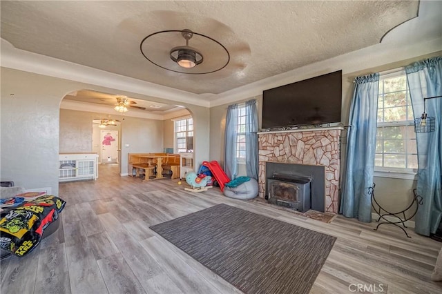2415 E Childs Ave, Merced, CA 95341 - rec room with arched walkways, a ceiling fan, wood finished floors, and a textured ceiling