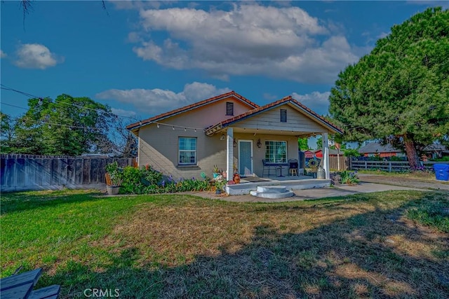 2415 E Childs Ave, Merced, CA 95341 - back of house with a lawn, fence, and a porch