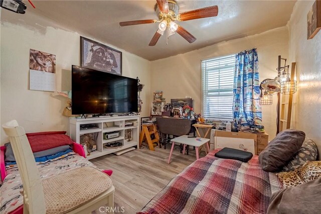 2415 E Childs Ave, Merced, CA 95341 - living room featuring a ceiling fan and wood finished floors