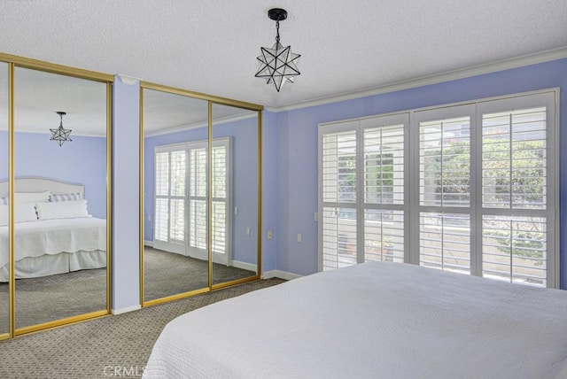 bedroom featuring crown molding, carpet flooring, two closets, and multiple windows