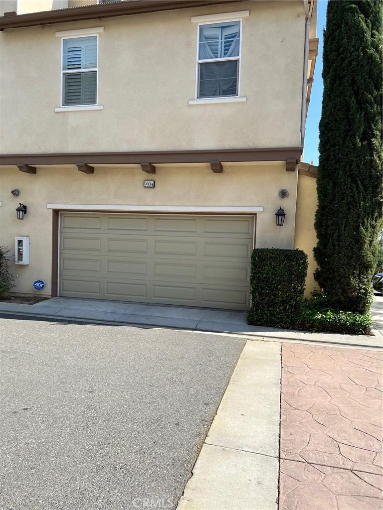 garage featuring driveway