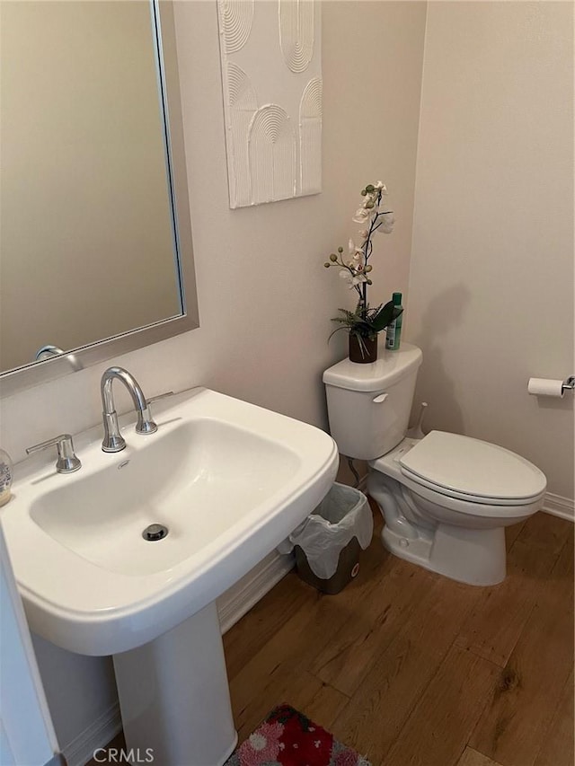 900 N Primrose Ln Unit A, Azusa, CA 91702 - half bathroom featuring toilet, wood finished floors, a sink, and baseboards