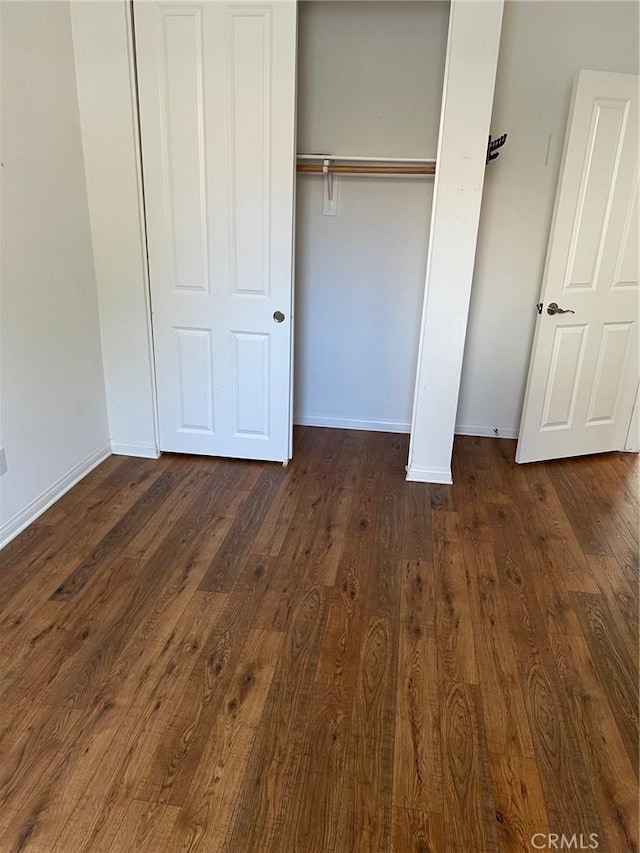 900 N Primrose Ln Unit A, Azusa, CA 91702 - unfurnished bedroom featuring dark wood-type flooring, baseboards, and a closet