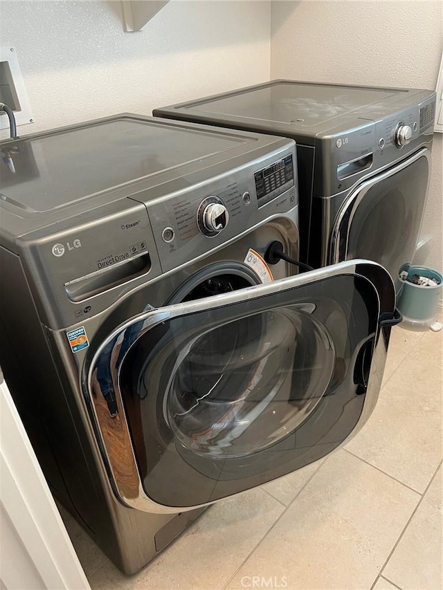 900 N Primrose Ln Unit A, Azusa, CA 91702 - laundry room with independent washer and dryer and tile patterned flooring