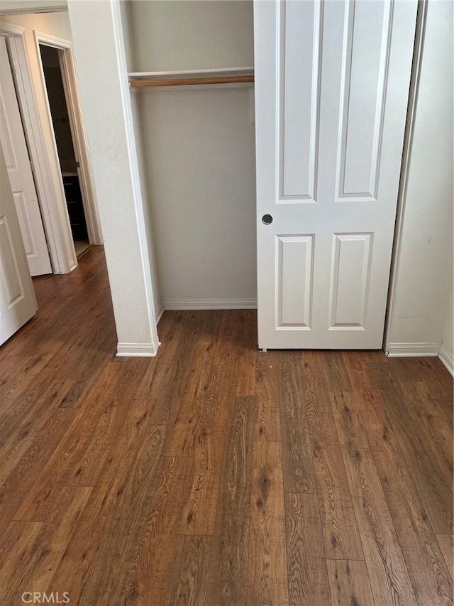 900 N Primrose Ln Unit A, Azusa, CA 91702 - unfurnished bedroom featuring baseboards, a closet, and dark wood-style flooring