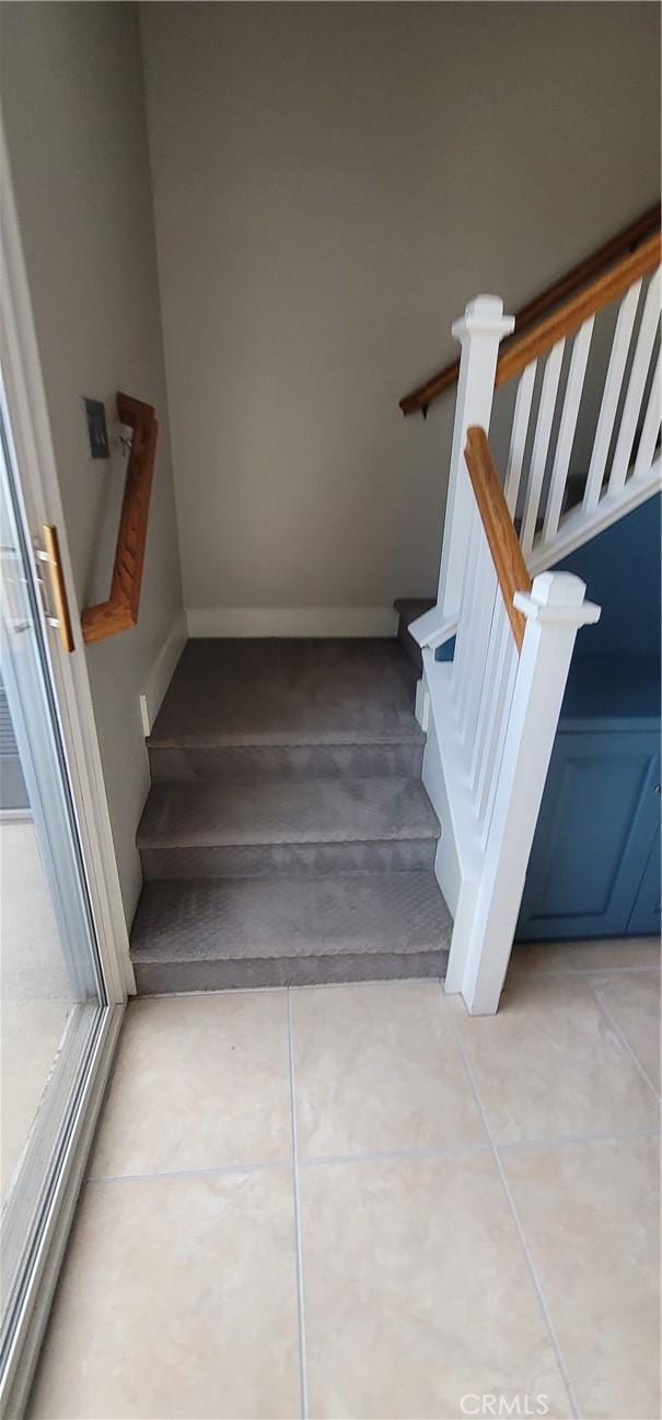 staircase with tile patterned flooring