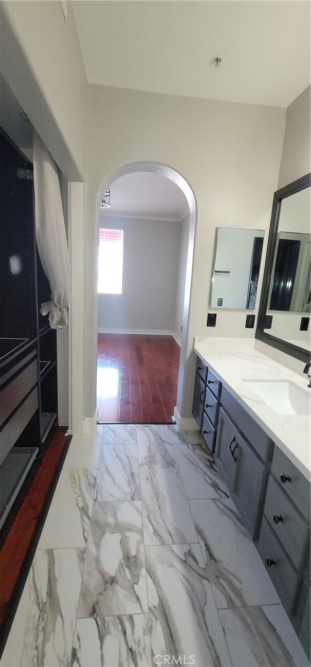bathroom featuring baseboards and vanity