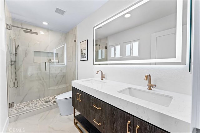 15 Glastonbury Pl, Laguna Niguel, CA 92677 - bathroom with visible vents, a sink, toilet, marble finish floor, and a marble finish shower