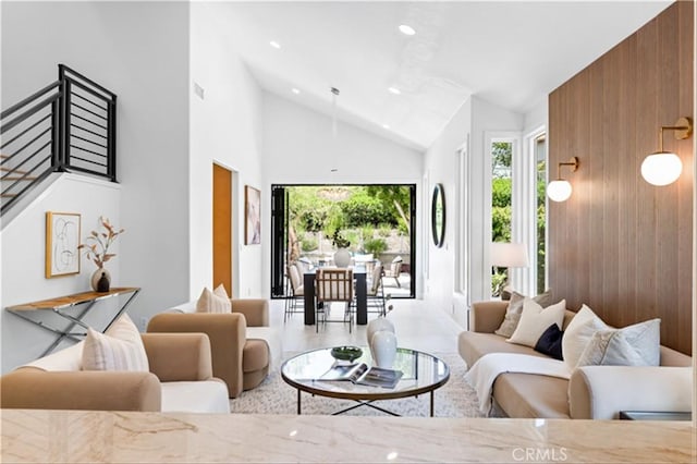 15 Glastonbury Pl, Laguna Niguel, CA 92677 - living room featuring recessed lighting, wooden walls, a healthy amount of sunlight, and high vaulted ceiling