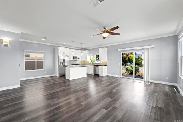 unfurnished living room featuring visible vents, dark wood-style flooring, baseboards, ceiling fan, and recessed lighting
