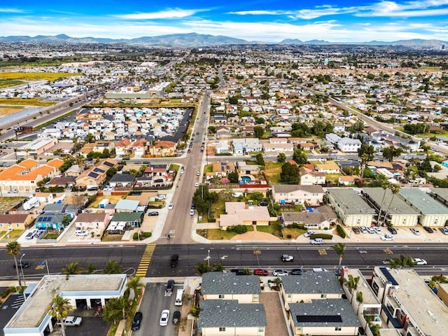 drone / aerial view featuring a residential view and a mountain view