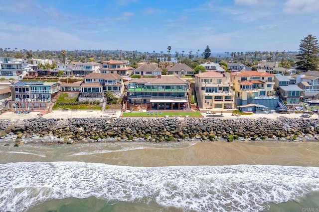 bird's eye view featuring a residential view and a water view