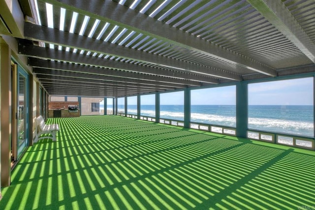 exterior space with a beach view and a water view