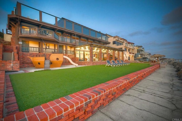 view of property's community with a yard