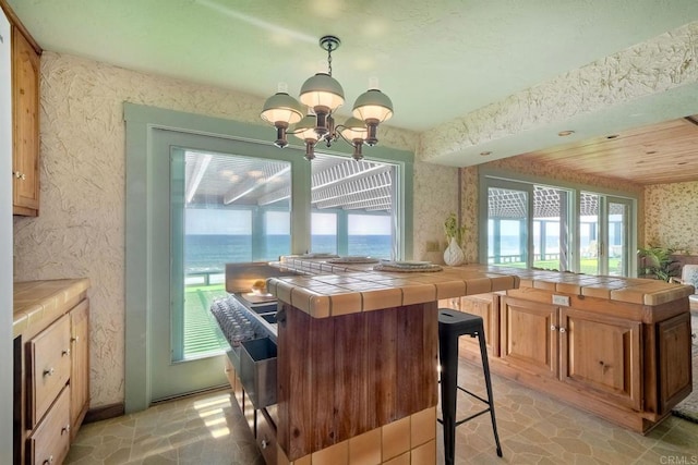 kitchen with tile counters and plenty of natural light