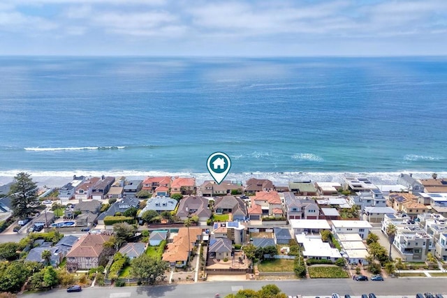 drone / aerial view featuring a water view and a residential view