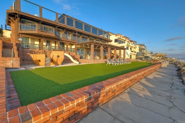 view of property's community with a yard
