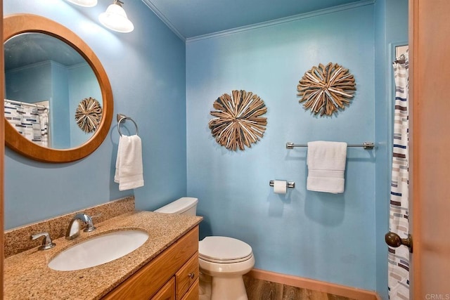 full bathroom featuring crown molding, vanity, toilet, curtained shower, and wood finished floors