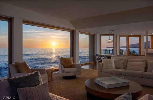 living area featuring a water view