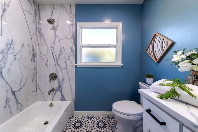 bathroom with toilet, baseboards, bathing tub / shower combination, and vanity