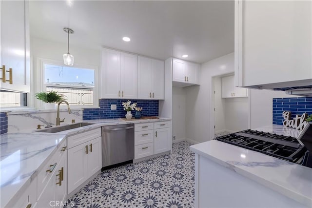 kitchen with a sink, white cabinetry, backsplash, and dishwasher