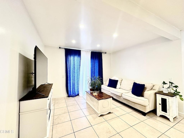 living room with light tile patterned floors, baseboards, and recessed lighting