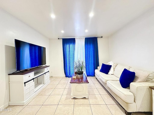 living room featuring recessed lighting, baseboards, and light tile patterned flooring