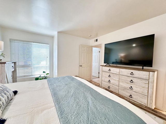 bedroom with visible vents