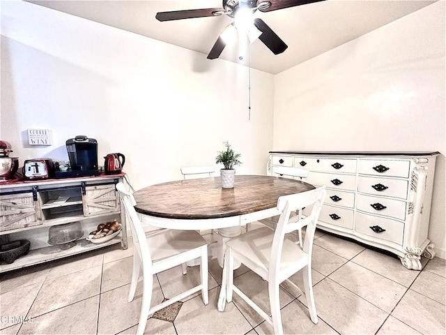 dining room featuring a ceiling fan and light tile patterned flooring