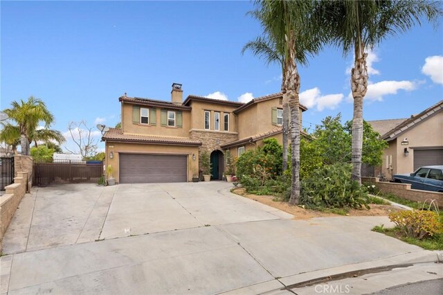 13216 Finish Draft Ct, Eastvale, CA 92880 - mediterranean / spanish-style house with a chimney, stucco siding, concrete driveway, an attached garage, and a tiled roof