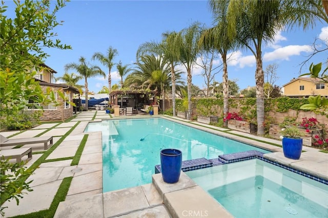 13216 Finish Draft Ct, Eastvale, CA 92880 - view of swimming pool featuring a fenced backyard, a pool with connected hot tub, and a gazebo