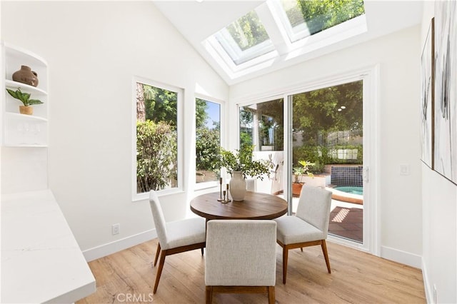 sunroom with a skylight and plenty of natural light