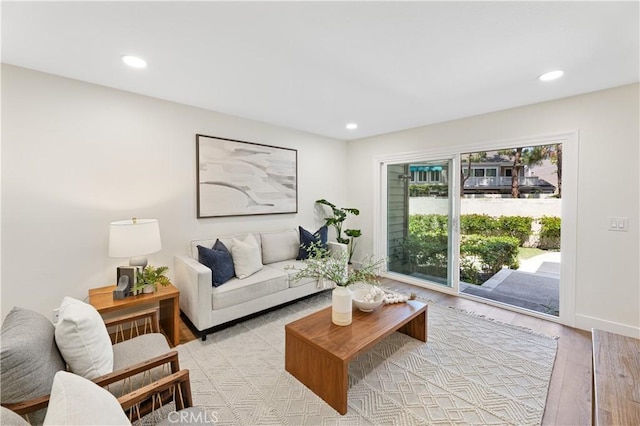 living area featuring recessed lighting and light wood finished floors
