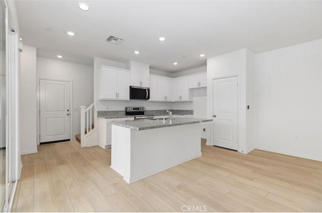 16188 Alamo, Chino, CA 91708 - kitchen with appliances with stainless steel finishes, a sink, white cabinetry, light stone countertops, and light wood-style floors