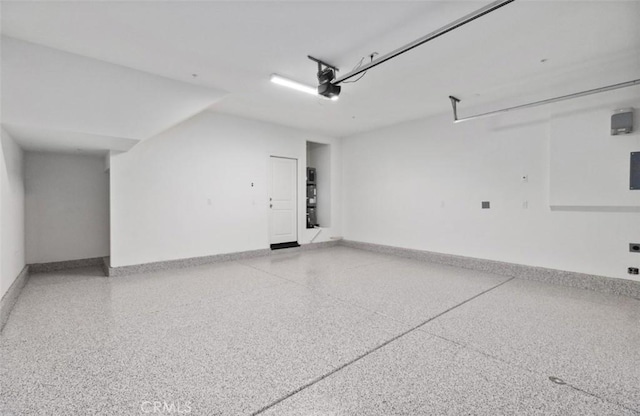 16188 Alamo, Chino, CA 91708 - garage with baseboards and a garage door opener
