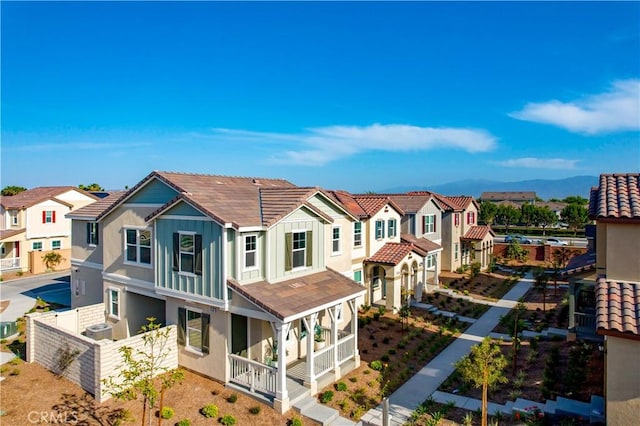 16188 Alamo, Chino, CA 91708 - back of property with a residential view, a tile roof, stucco siding, and covered porch