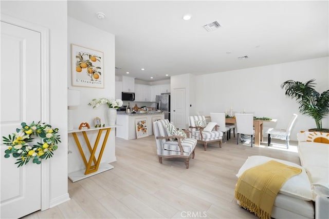 16188 Alamo, Chino, CA 91708 - living room featuring light wood-style floors and recessed lighting