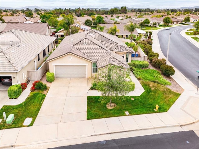 bird's eye view with a residential view and a mountain view