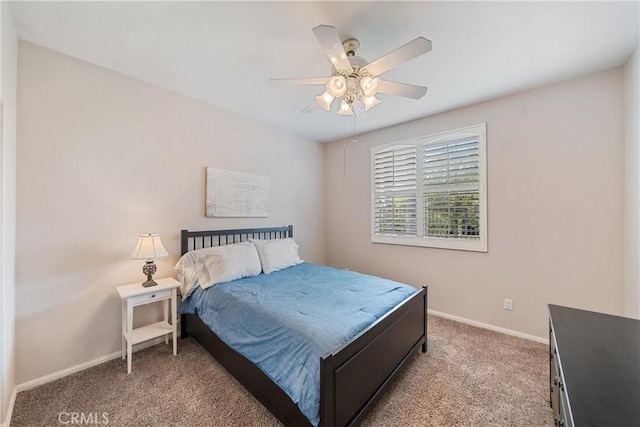 bedroom with baseboards, light carpet, and ceiling fan