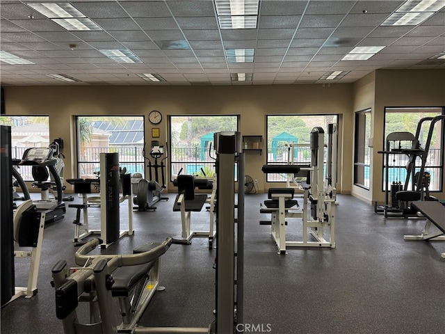 exercise room featuring a drop ceiling