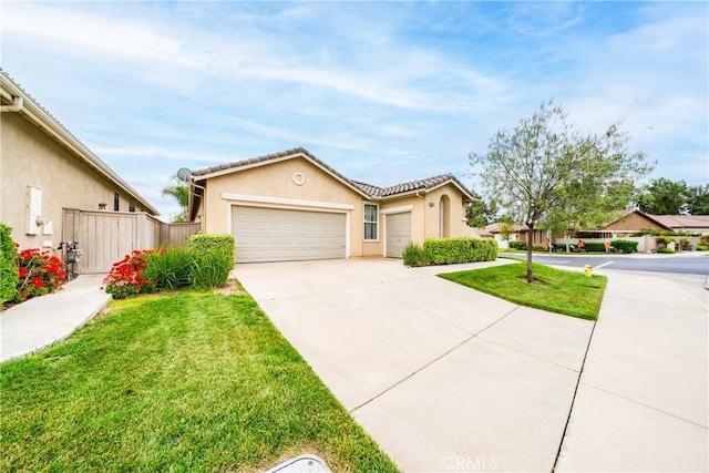 single story home with a garage, stucco siding, driveway, and a front yard
