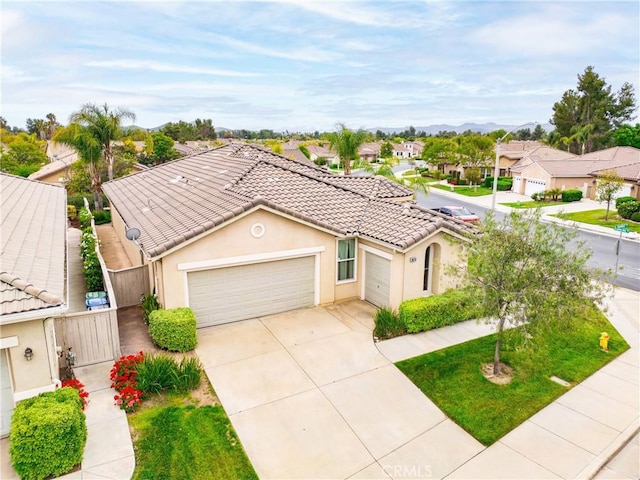 28713 Raintree, Menifee, CA 92584 - view of front of house featuring a tile roof, a residential view, a garage, concrete driveway, and stucco siding
