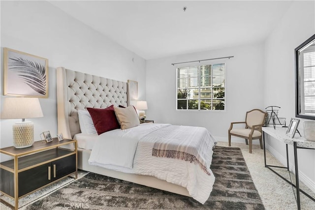 bedroom with baseboards and carpet flooring