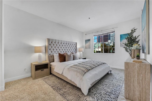 carpeted bedroom featuring baseboards
