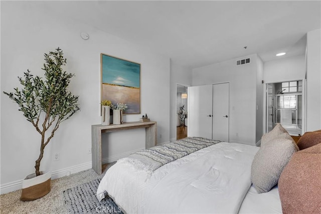 bedroom featuring visible vents, carpet flooring, and baseboards