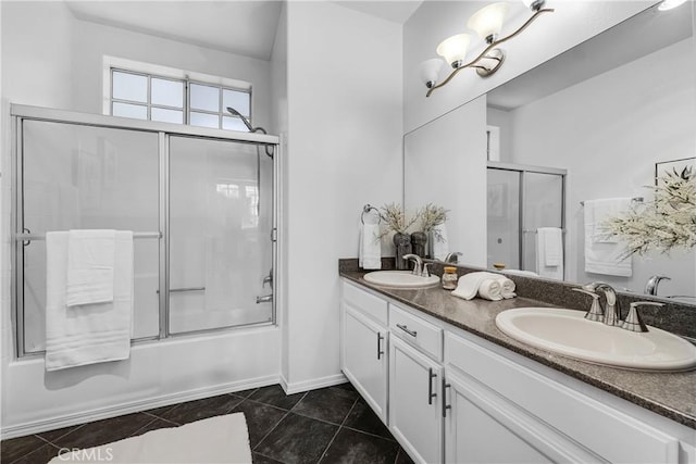 bathroom featuring a sink, tile patterned floors, double vanity, and shower / bath combination with glass door