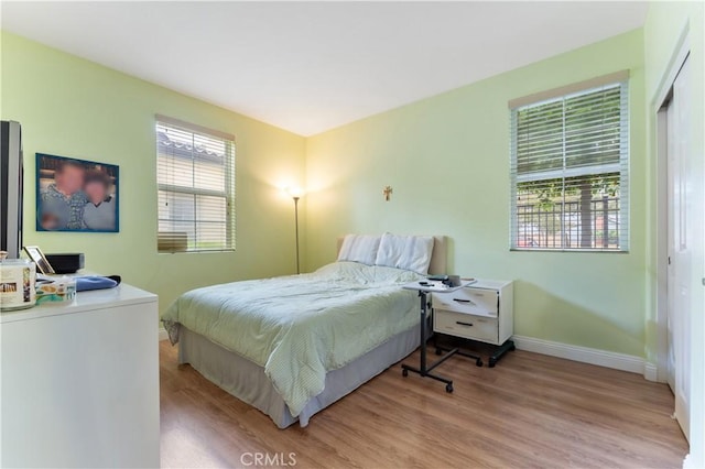 13435 Cascade Ct, Cerritos, CA 90703 - bedroom with baseboards and light wood-style floors