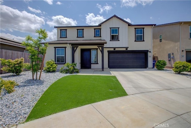218 Bryce Canyon Ct, Merced, CA 95341 - view of front of house featuring fence, a garage, concrete driveway, board and batten siding, and stucco siding