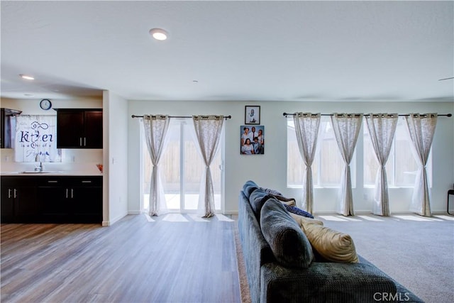 218 Bryce Canyon Ct, Merced, CA 95341 - living area featuring baseboards, recessed lighting, and light wood-type flooring
