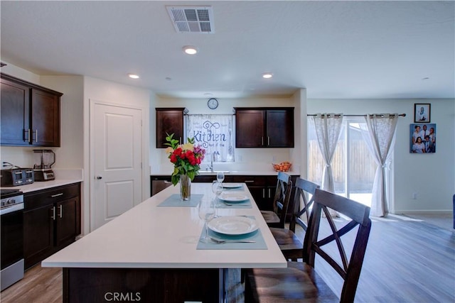 218 Bryce Canyon Ct, Merced, CA 95341 - dining area featuring light wood-type flooring, recessed lighting, and baseboards
